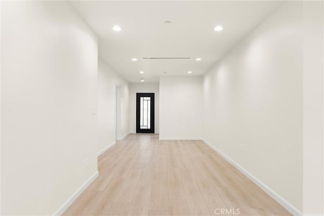 hall with light hardwood / wood-style floors