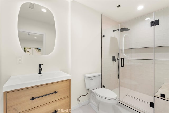 bathroom featuring an enclosed shower, vanity, and toilet