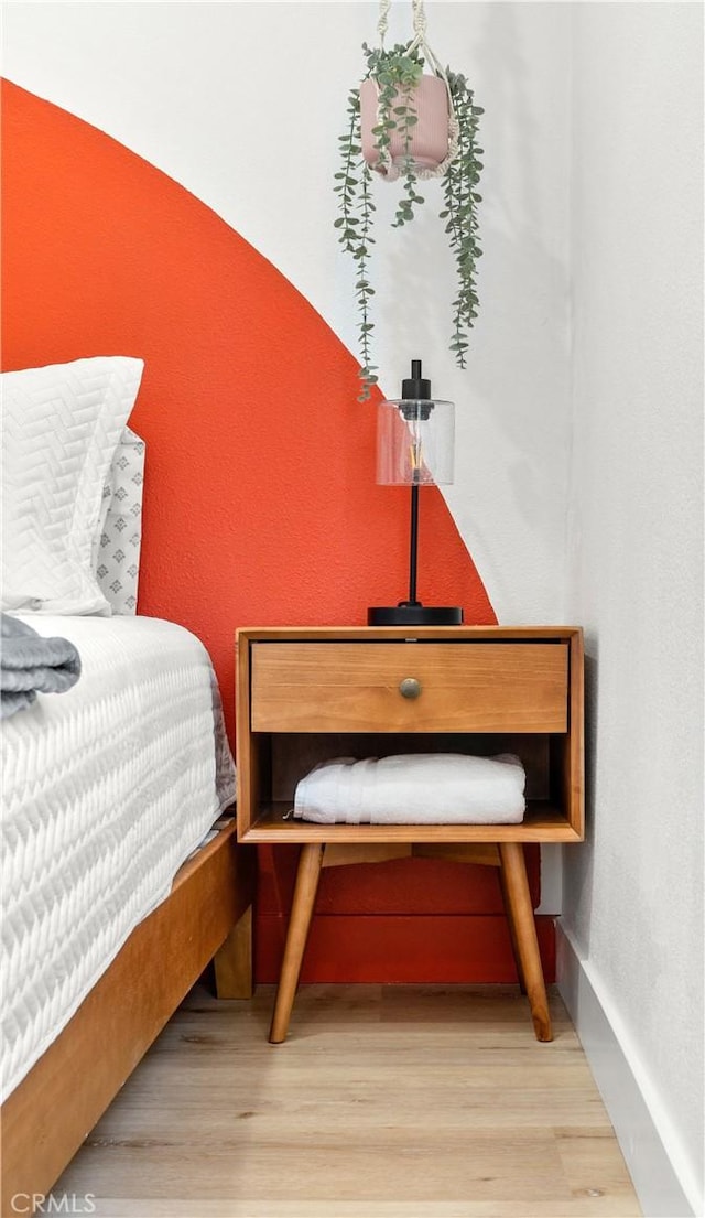 bedroom with wood-type flooring