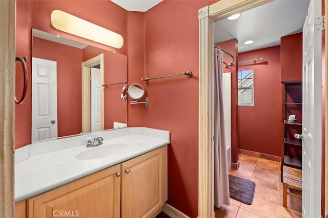 bathroom with vanity, shower / bathtub combination with curtain, and tile patterned flooring