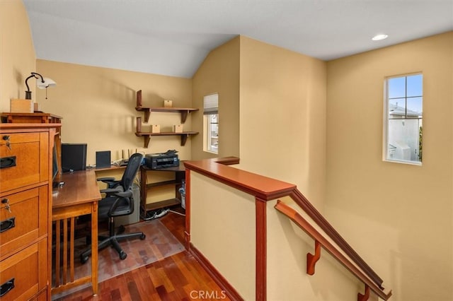 home office with vaulted ceiling, dark wood-type flooring, and a wealth of natural light