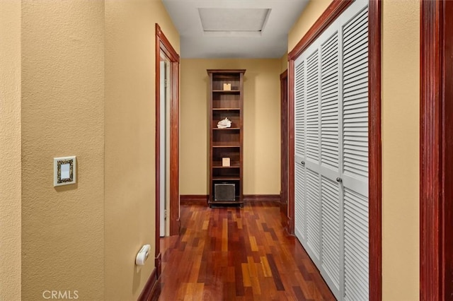 corridor featuring dark hardwood / wood-style flooring