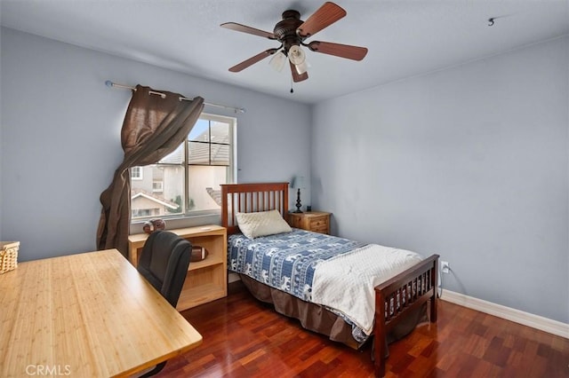 bedroom featuring ceiling fan and dark wood-type flooring