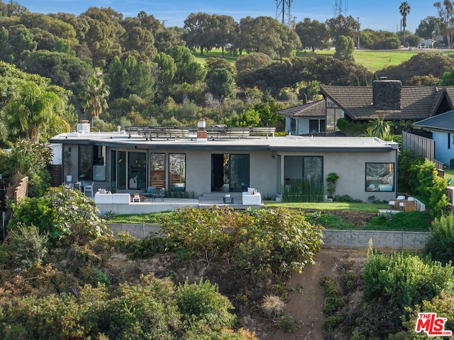 back of property featuring a patio