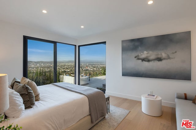 bedroom with light hardwood / wood-style floors