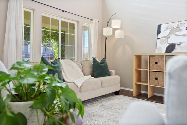 living area with hardwood / wood-style flooring