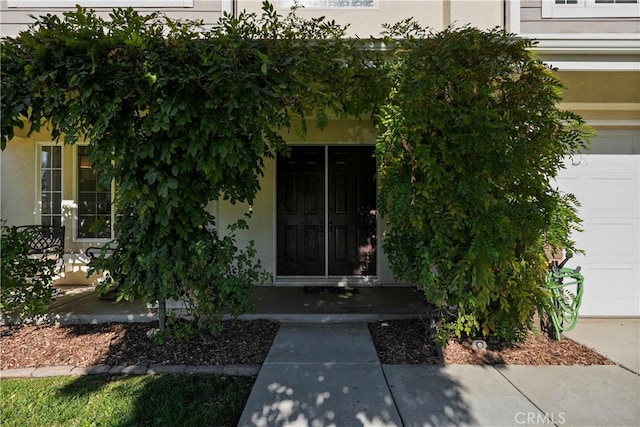 property entrance with a garage