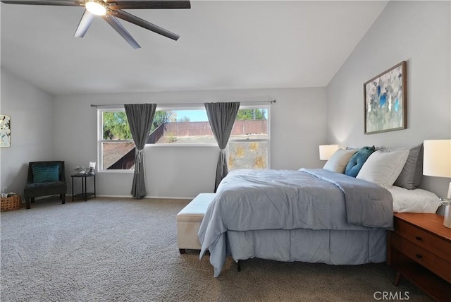 bedroom featuring ceiling fan, carpet floors, and vaulted ceiling