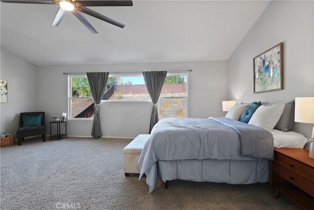 bedroom with ceiling fan, multiple windows, carpet, and lofted ceiling