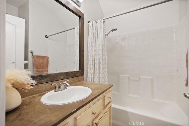 bathroom with vanity and shower / bath combination with curtain