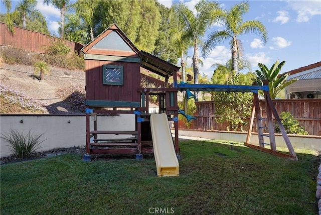 view of jungle gym with a lawn