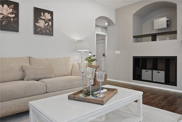 living room with dark hardwood / wood-style floors