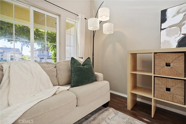 living area with hardwood / wood-style floors