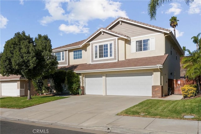 view of front of home with a front yard and a garage