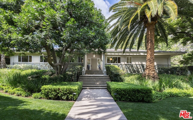 view of front of home with a front yard