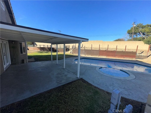 view of swimming pool featuring a patio area