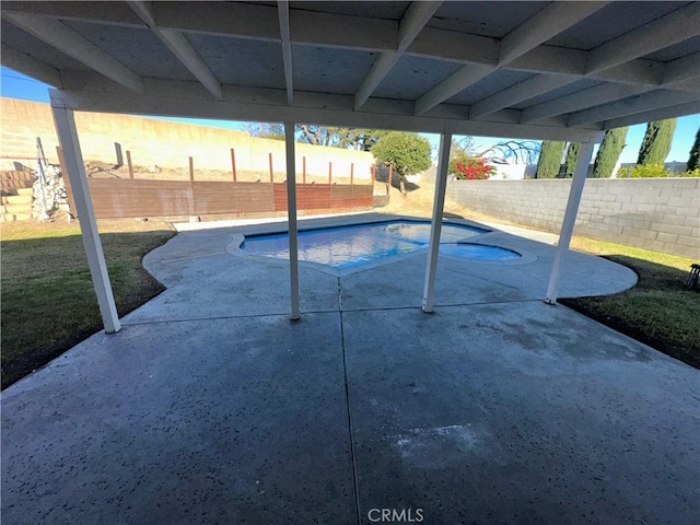 view of swimming pool featuring a patio area