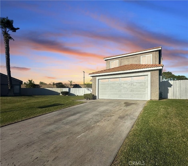 garage at dusk with a yard