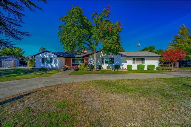 ranch-style house with a front lawn