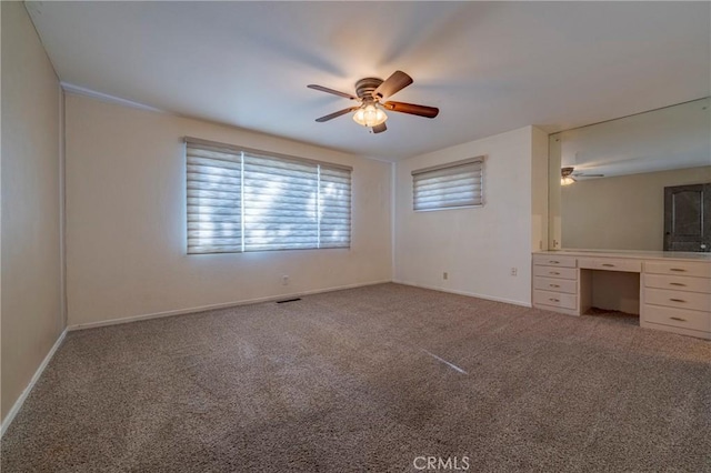 unfurnished bedroom with carpet flooring and ceiling fan