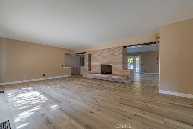 unfurnished living room featuring light hardwood / wood-style floors