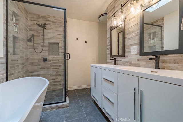 bathroom featuring tasteful backsplash, tile patterned floors, vanity, and plus walk in shower