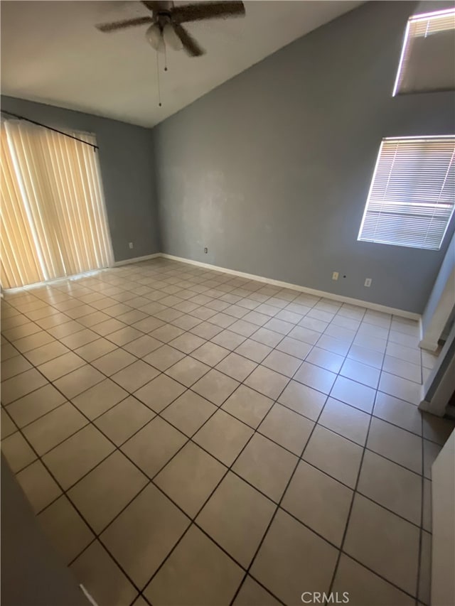 spare room featuring ceiling fan and light tile patterned flooring