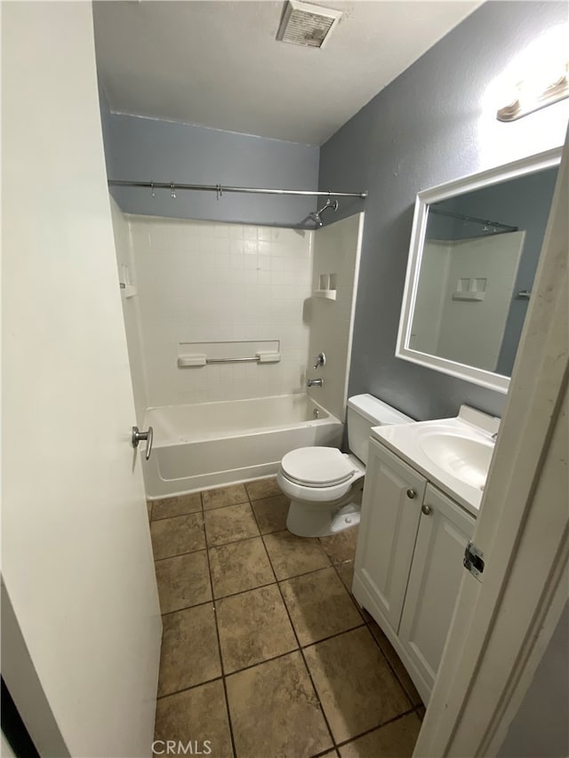 full bathroom with tile patterned flooring, vanity, shower / bath combination, and toilet