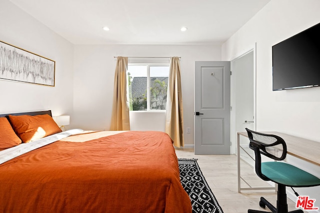 bedroom with light hardwood / wood-style floors