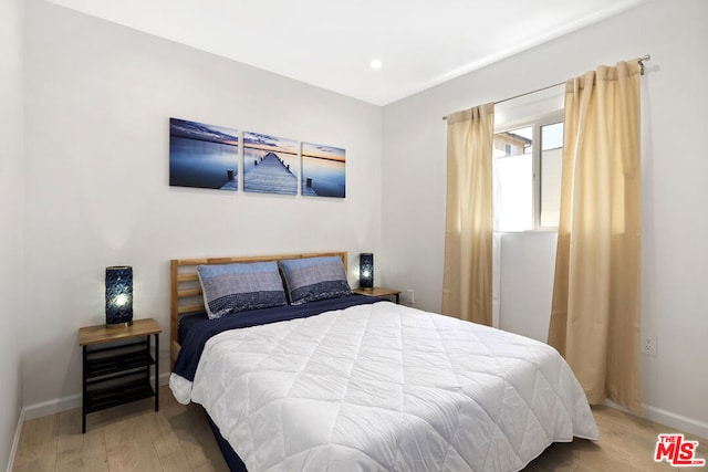 bedroom featuring hardwood / wood-style flooring