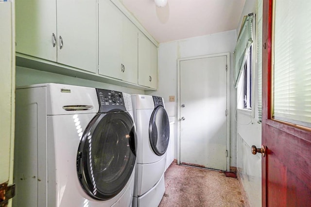 laundry area featuring cabinets and washing machine and dryer