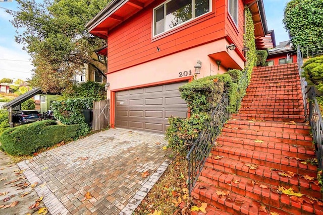 view of side of property featuring a garage