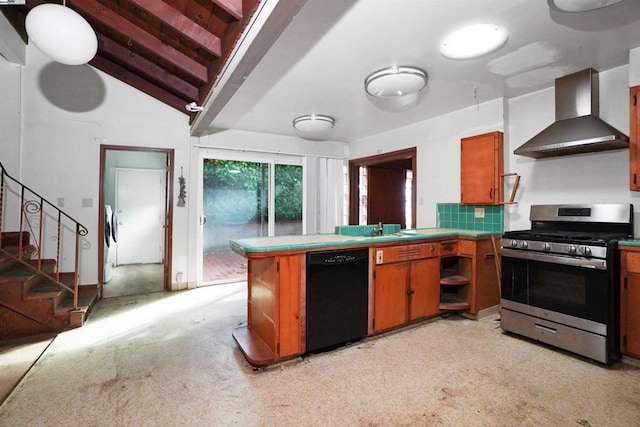 kitchen featuring sink, dishwasher, wall chimney exhaust hood, vaulted ceiling, and stainless steel range with gas stovetop