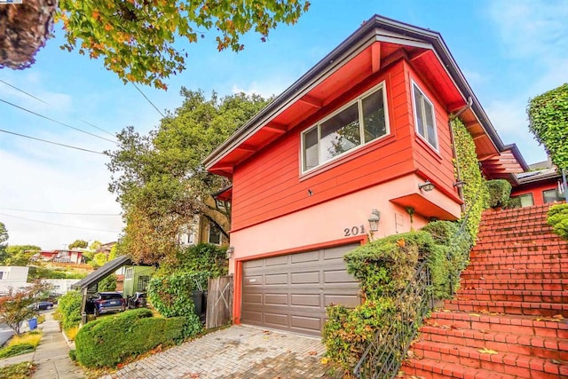 view of property exterior featuring a garage