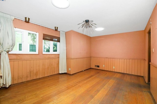 unfurnished room featuring light hardwood / wood-style floors