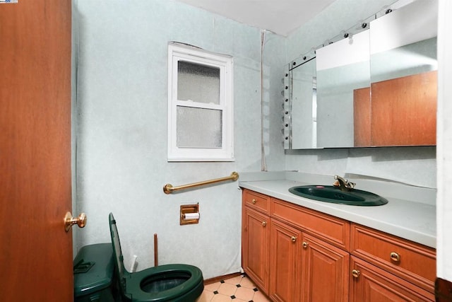 bathroom featuring vanity and toilet