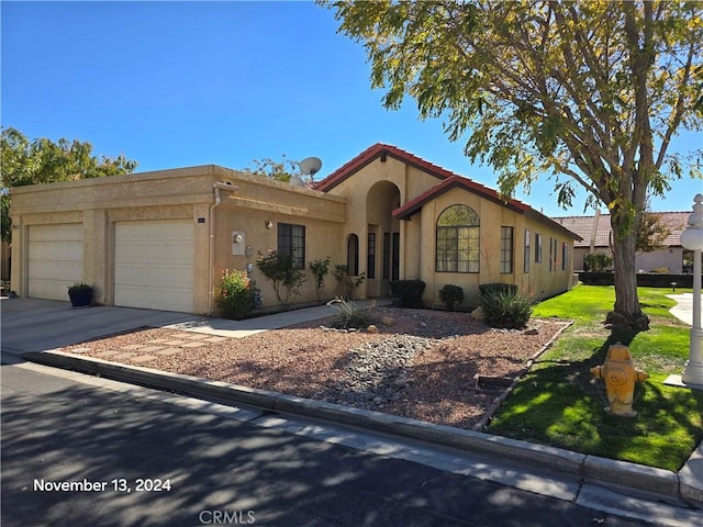 view of front of property with a garage