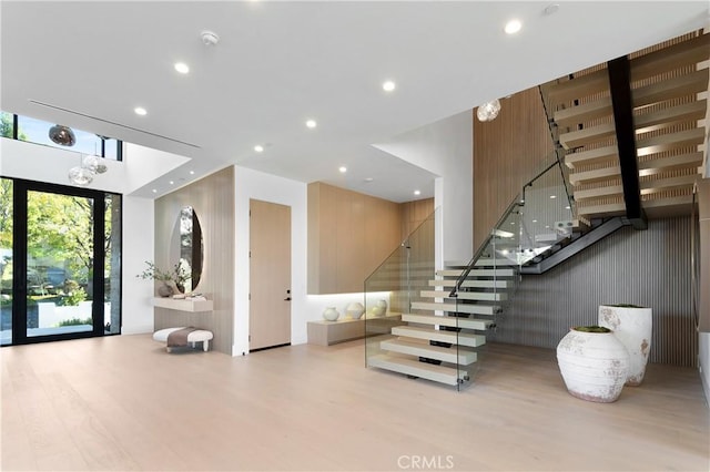 staircase with hardwood / wood-style flooring