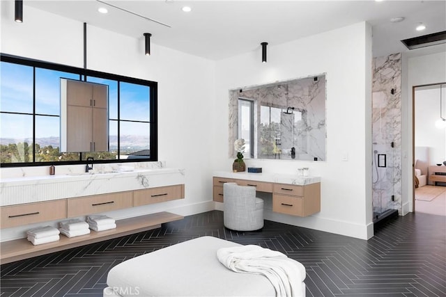 bathroom featuring vanity, a healthy amount of sunlight, an enclosed shower, and parquet flooring