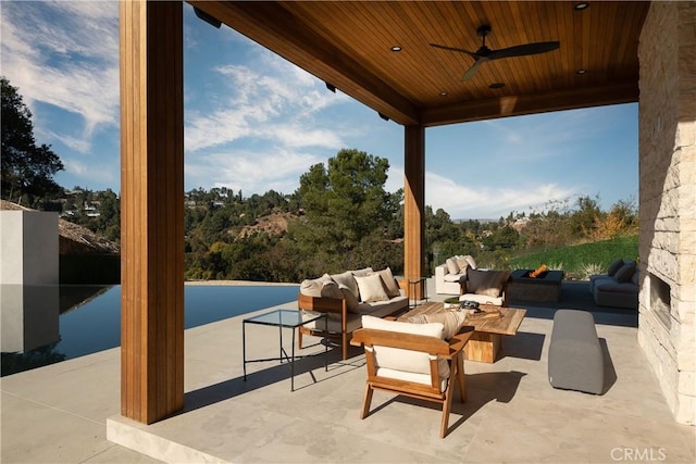 view of patio / terrace with ceiling fan and an outdoor hangout area