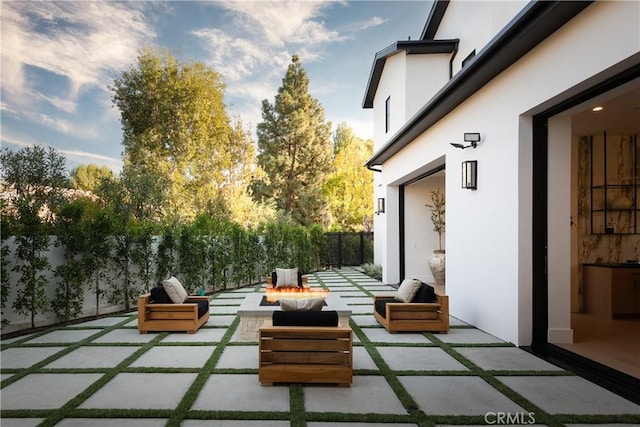 view of patio / terrace featuring a fire pit