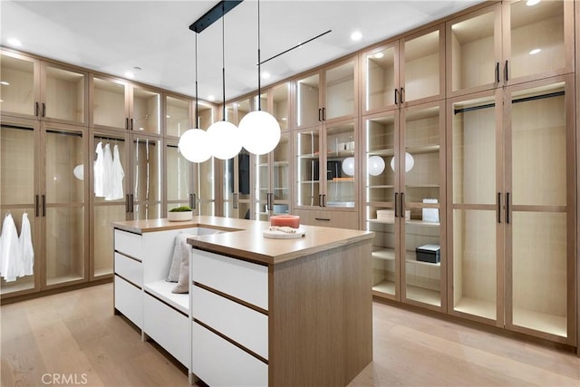 spacious closet featuring light wood-type flooring