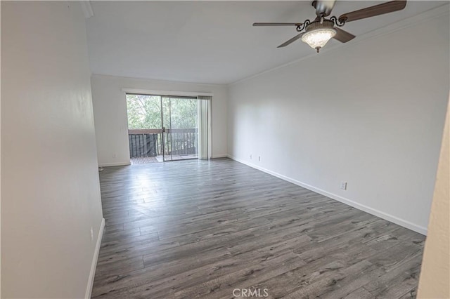 unfurnished room featuring dark hardwood / wood-style floors, ceiling fan, and ornamental molding