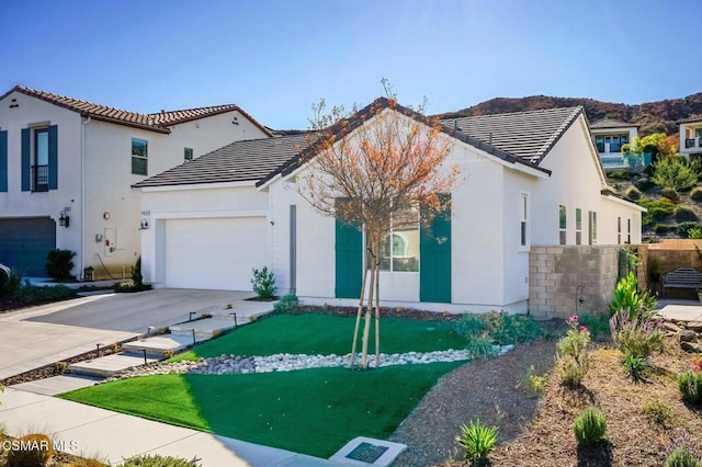 mediterranean / spanish-style house featuring a garage