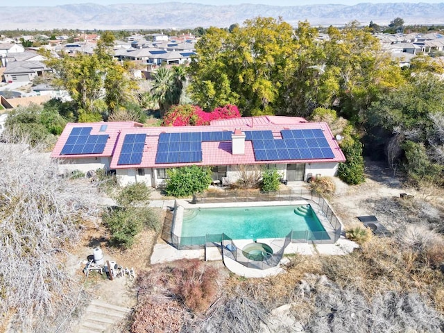 birds eye view of property featuring a mountain view