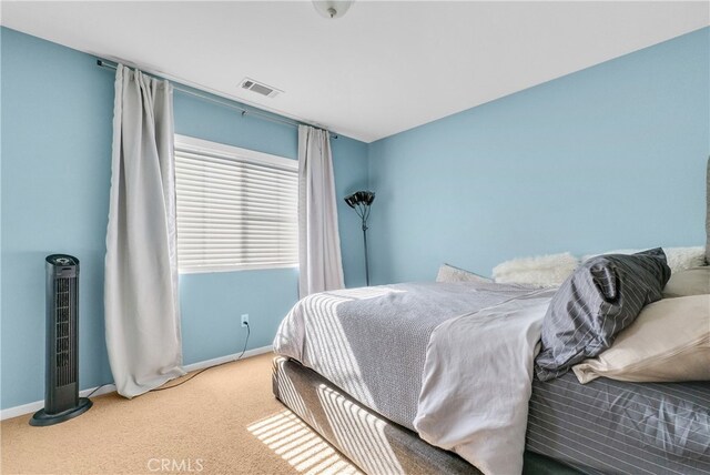 bedroom featuring carpet