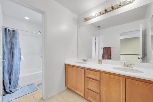 bathroom featuring vanity, tile patterned flooring, and shower / bathtub combination with curtain