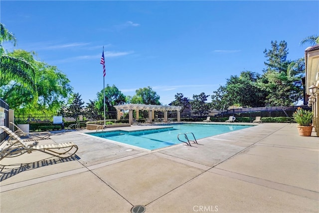 view of swimming pool with a pergola and a patio