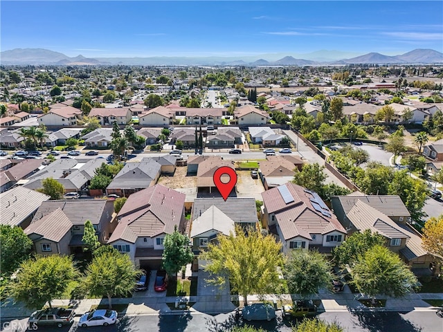 birds eye view of property featuring a mountain view