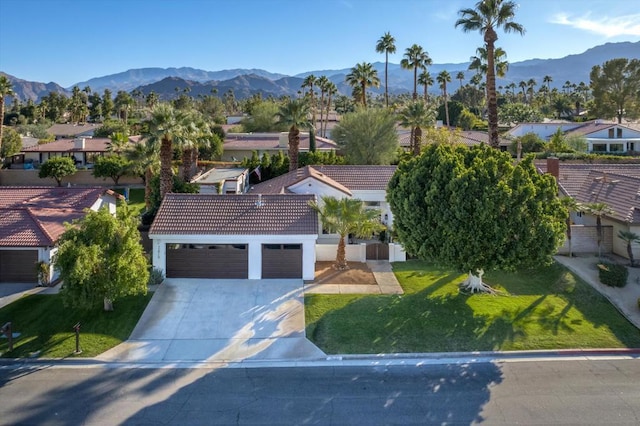 birds eye view of property with a mountain view